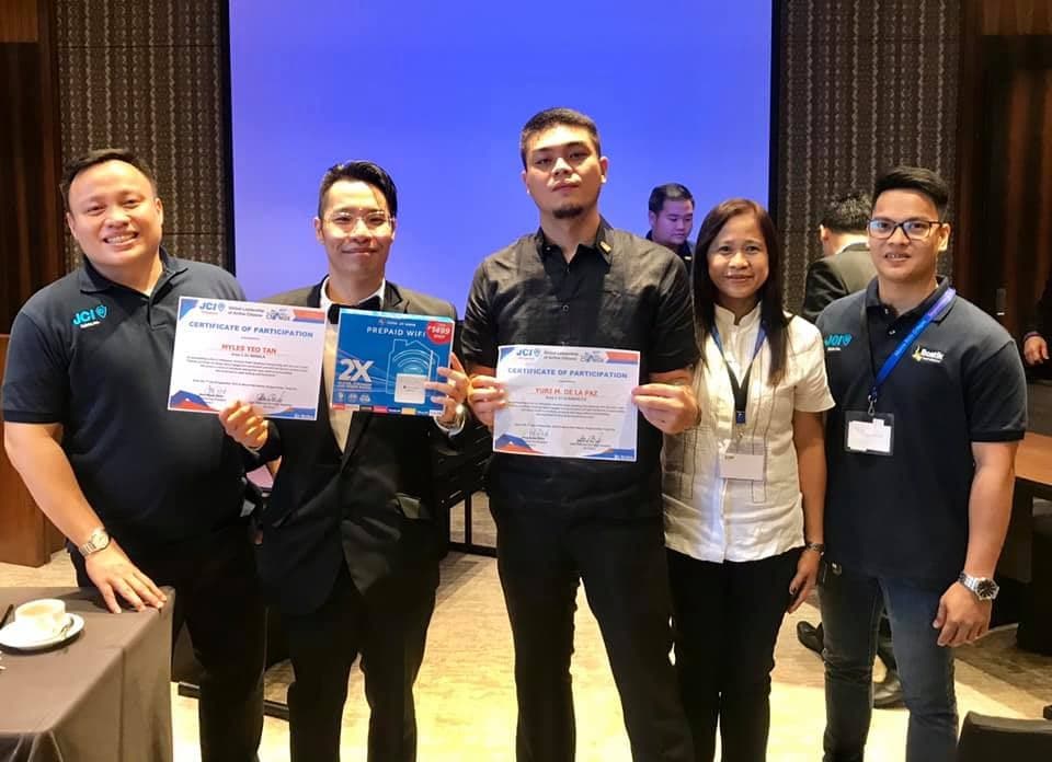 Myles Yeotan and JCI Manila team holding certificates at the JCI Area 2 Convention AreaCon 2019 speech contest